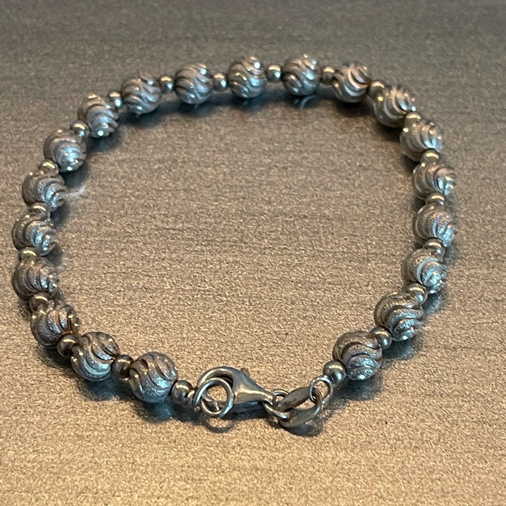 Macys sterling silver bracelet with small diamonds.